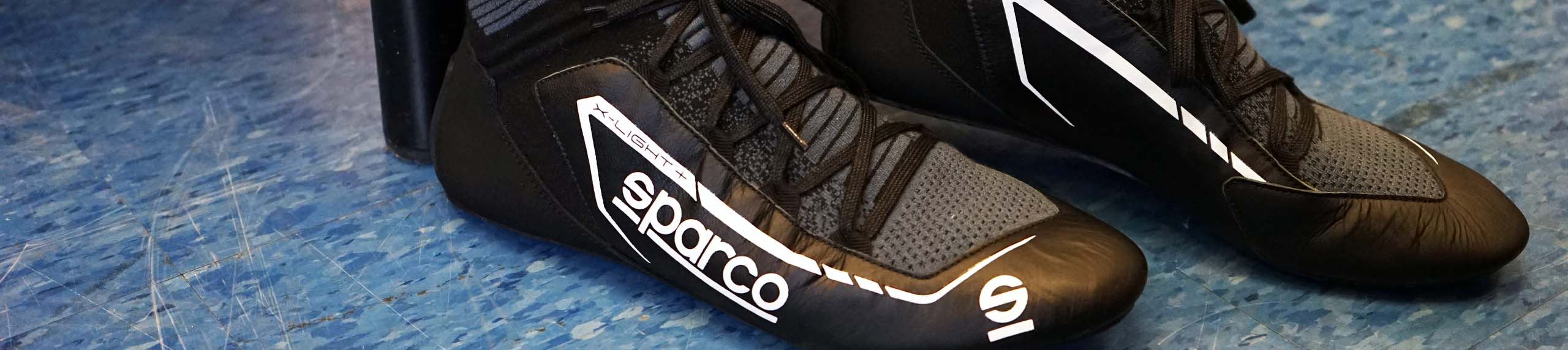 Sparco auto and kart racing gear with professional racing seats, harnesses, and motorsports accessories