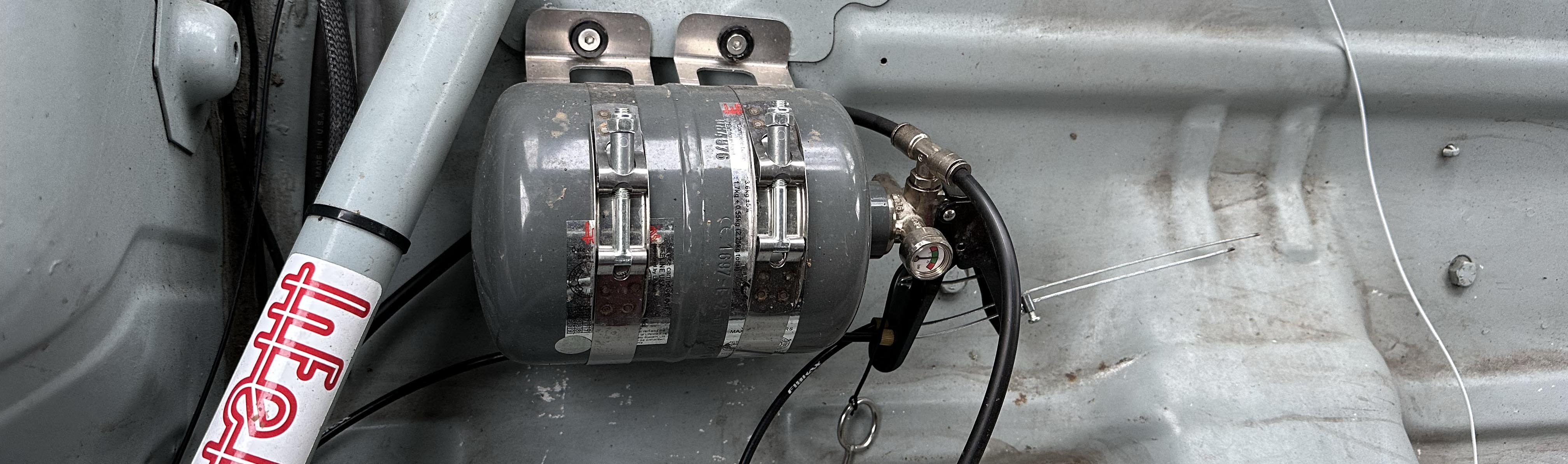 Lifeline fire suppression systems and racing harnesses installed in professional motorsports safety applications