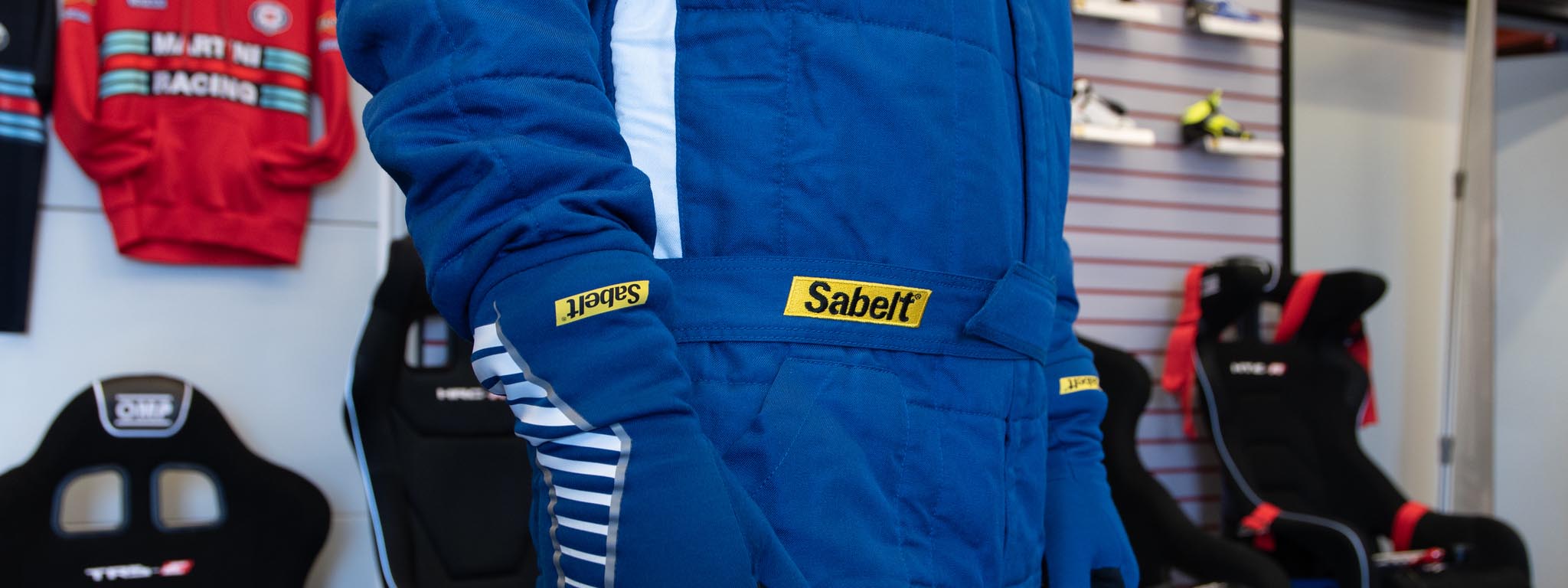 Sabelt racing harnesses, seats, and motorsports safety gear used in professional auto racing environments